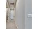 Bright hallway with tile flooring, neutral walls and recessed lighting at 3753 Maxwell Park Dr, Sun City Center, FL 33573