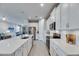 Spacious kitchen with modern appliances, island seating, and ample counter space at 3753 Maxwell Park Dr, Sun City Center, FL 33573