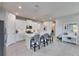 Modern kitchen with stainless appliances, island seating, and ample cabinet space at 3753 Maxwell Park Dr, Sun City Center, FL 33573