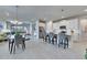 Bright, open-concept living space featuring modern decor, stainless steel appliances, and tile flooring at 3753 Maxwell Park Dr, Sun City Center, FL 33573