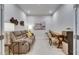 Cozy living room space featuring hard floors and a couch at 3753 Maxwell Park Dr, Sun City Center, FL 33573