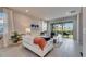 Bright living room with sliding doors to the outdoor patio and neutral decor for relaxing or entertaining at 3753 Maxwell Park Dr, Sun City Center, FL 33573