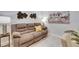 Comfortable living room featuring a plush sofa and stylish decor at 3753 Maxwell Park Dr, Sun City Center, FL 33573