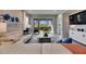 Bright living room with sliding doors to the outdoor patio and neutral decor, perfect for relaxing or entertaining at 3753 Maxwell Park Dr, Sun City Center, FL 33573