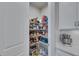 Organized walk-in pantry with adjustable wire shelves, filled with food items and storage containers at 3753 Maxwell Park Dr, Sun City Center, FL 33573