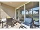 Covered patio with comfortable seating and dining area, perfect for enjoying the outdoors at 3753 Maxwell Park Dr, Sun City Center, FL 33573
