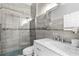 Modern bathroom with glass-enclosed shower and sleek vanity with marble countertop at 381 Tavernier Cir, Oldsmar, FL 34677