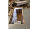 View of attic access with pull down stairs and finished room below at 3911 La Costa Ln, Largo, FL 33771