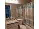 Bathroom with vanity, toilet, shower tub combo, and vanity mirror at 3911 La Costa Ln, Largo, FL 33771