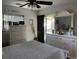 Bright bedroom with white furniture, ceiling fan, and access to a screened-in porch at 3911 La Costa Ln, Largo, FL 33771