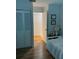 Bedroom features hardwood floors, spacious closet, and white trim at 3911 La Costa Ln, Largo, FL 33771