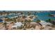 Aerial view of waterfront community with palm trees, boat docks and beautiful waterfront canal access at 420 64Th Ave # 907, St Pete Beach, FL 33706