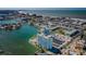 Aerial view showcasing coastal living with a waterfront condo, a pool and easy access to nearby beaches at 420 64Th Ave # 907, St Pete Beach, FL 33706