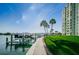 Scenic marina with boat dock, palm trees, and well-maintained walkway near the tower at 420 64Th Ave # 907, St Pete Beach, FL 33706