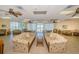 Relax in this common room with two large sofas, tile floors, and ceiling fans at 420 64Th Ave # 907, St Pete Beach, FL 33706