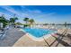 Enjoy this luxurious outdoor pool with brick patio and waterfront views on a sunny day at 420 64Th Ave # 907, St Pete Beach, FL 33706