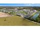 Aerial view of a new residential development featuring ponds and lush green spaces at 4212 Cloud Hopper Way, Lutz, FL 33559