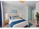 Calm bedroom with plush bedding, soft lighting, and a stylish accent wall at 4212 Cloud Hopper Way, Lutz, FL 33559