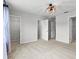 Bedroom with carpet flooring, closet and neutral paint at 4212 Cloud Hopper Way, Lutz, FL 33559