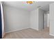 A well-lit, carpeted bedroom showcases neutral walls and a window for ample natural light at 4212 Cloud Hopper Way, Lutz, FL 33559