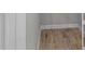 View of the floor of a closet featuring wood-style floor and white trim at 4212 Cloud Hopper Way, Lutz, FL 33559