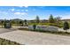 Volanti community entrance showcasing manicured landscaping and stone signage under a blue sky at 4212 Cloud Hopper Way, Lutz, FL 33559