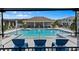 View of the community pool offering clear water and ample lounging space under a blue sky at 4212 Cloud Hopper Way, Lutz, FL 33559