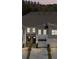 A picturesque view of several townhomes, highlighting their architectural uniformity and appealing landscaping at 4212 Cloud Hopper Way, Lutz, FL 33559