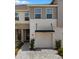 Charming home with a covered porch and a landscaped walkway to the front door at 4212 Cloud Hopper Way, Lutz, FL 33559