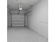 A well-lit and spacious two car garage with sealed concrete floors at 4212 Cloud Hopper Way, Lutz, FL 33559