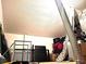 Attic featuring storage items, a ladder, and a metal duct at 4275 Castlebridge Ln # 1325, Sarasota, FL 34238