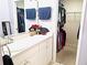 Bathroom featuring a vanity with a sink, and a walk-in closet with hanging clothes at 4275 Castlebridge Ln # 1325, Sarasota, FL 34238