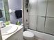 Standard bathroom with white sink, toilet and shower/tub with sliding door at 4275 Castlebridge Ln # 1325, Sarasota, FL 34238