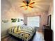 Bright bedroom with a ceiling fan, natural light, and hard surface flooring at 4275 Castlebridge Ln # 1325, Sarasota, FL 34238