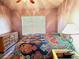 This bedroom offers natural light from the window, complemented by a dresser and nightstand at 4275 Castlebridge Ln # 1325, Sarasota, FL 34238