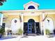 Clubhouse featuring a welcoming entrance with plants and comfortable seating at 4275 Castlebridge Ln # 1325, Sarasota, FL 34238
