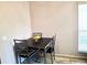 Dining space with a table featuring fruit and 4 chairs under warm lighting at 4275 Castlebridge Ln # 1325, Sarasota, FL 34238