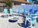 An outdoor fire pit surrounded by Adirondack chairs perfect for cozy evenings and social gatherings at 4275 Castlebridge Ln # 1325, Sarasota, FL 34238