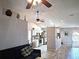Open floor plan showcasing kitchen, living area and vaulted ceiling with ceiling fans at 4275 Castlebridge Ln # 1325, Sarasota, FL 34238