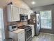 Well-equipped kitchen with stainless steel appliances and plenty of cabinet storage at 4275 Castlebridge Ln # 1325, Sarasota, FL 34238