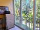 Bright office space with a large window overlooking lush greenery offers a serene workspace at 4275 Castlebridge Ln # 1325, Sarasota, FL 34238