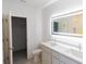 Bright bathroom features double vanity, dual sinks, and a lighted mirror at 434 Albatross Rd, Rotonda West, FL 33947