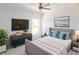 Stylish bedroom featuring chic decor, a large television, and ample space for relaxation and rest at 434 Albatross Rd, Rotonda West, FL 33947