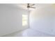 Inviting bedroom features tile flooring, a modern ceiling fan, and large window to let the sunshine in at 434 Albatross Rd, Rotonda West, FL 33947