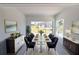 Elegant dining room featuring a modern table set, sophisticated decor, and abundant natural light at 434 Albatross Rd, Rotonda West, FL 33947