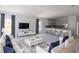 Spacious living room showcases a modern design with an open layout flowing seamlessly into the kitchen at 434 Albatross Rd, Rotonda West, FL 33947