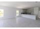 Open floor plan living room flows into kitchen with long island at 434 Albatross Rd, Rotonda West, FL 33947