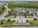 Overhead view features the community clubhouse, pool, and manicured landscaping, emphasizing the luxurious setting at 4849 Isola Ct, Wesley Chapel, FL 33543