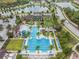 Community featuring resort-style pool with palm trees and blue lounge chairs, enhancing the community's appeal at 4849 Isola Ct, Wesley Chapel, FL 33543