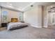 Serene main bedroom with neutral tones, tray ceiling, plush carpet and large windows providing ample natural light at 4849 Isola Ct, Wesley Chapel, FL 33543